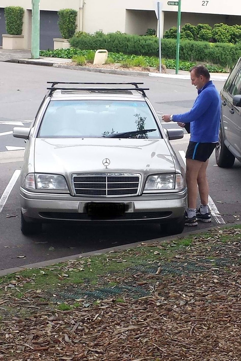 here’s a photo of tony abbott coming back to a parking ticket at balmoral this morning