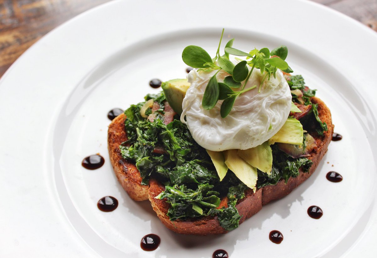 Kick off brunch with this brand-new app! Try our Avocado Toast with Smoked Bacon, Braised Kale and a Poached Egg! bit.ly/2Cw8LN8