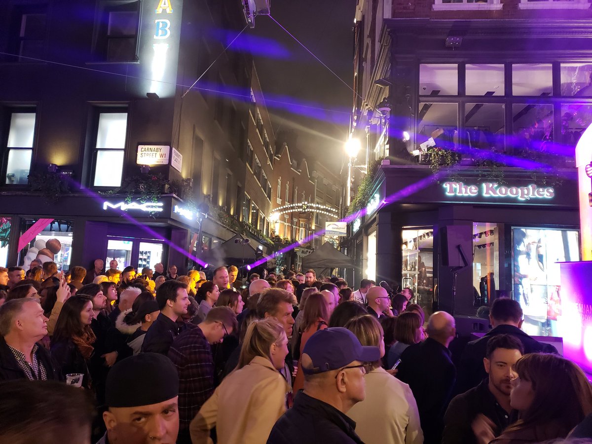 colliderfrosty's tweet photo. Hello from London.
Attending a #BohemianRhapsody Carnaby Street lightning. Cast will be here soon. It's very crowded. 

Even though it's super crowded the speakers are blasting @QueenWillRock music and everyone is singing and having fun. https://t.co/EWrBnkJNdp
