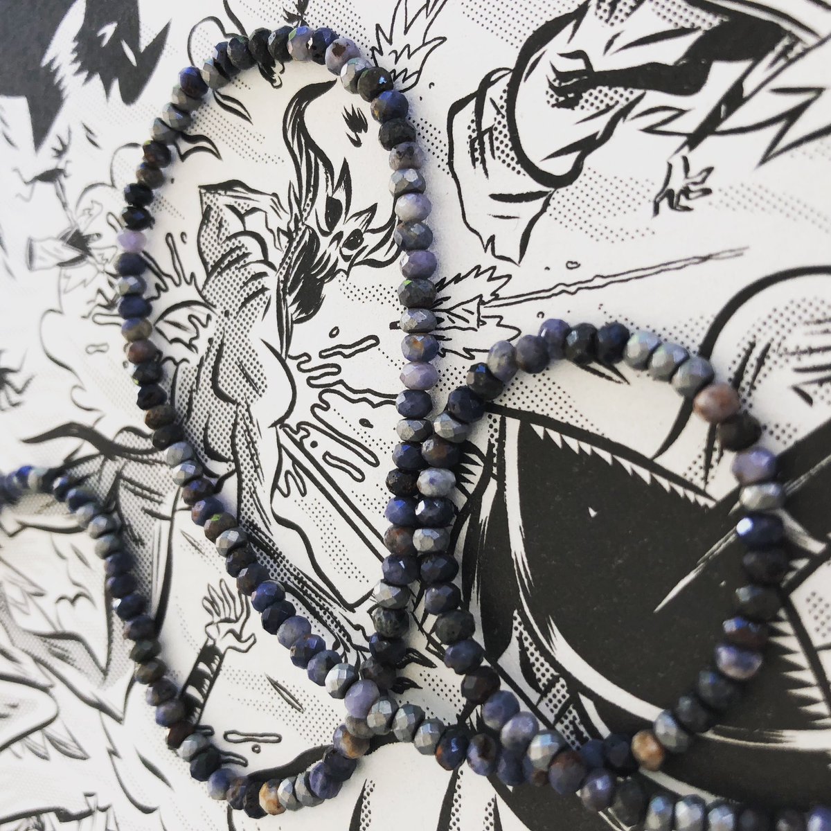 sunnybarrington's tweet photo. #sodalite and #pyrite #necklace displayed on pages of #blackmetal graphicnovel by #rickspears and #chuckbb #beadsandbooks 
#sondrabarrington https://t.co/GxNkDQrgot