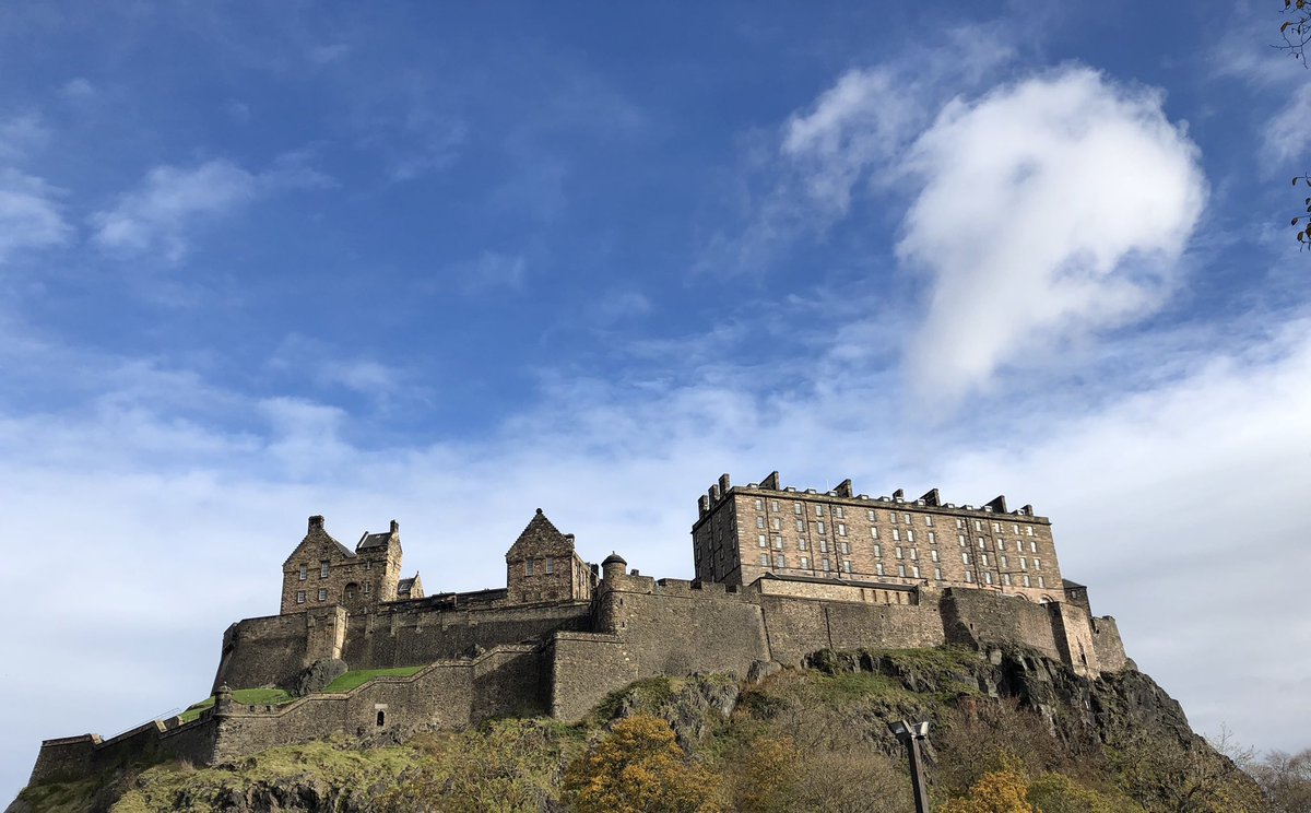 Edinburgh castle up on the hill - wispy white clouds and sunshine in mid October