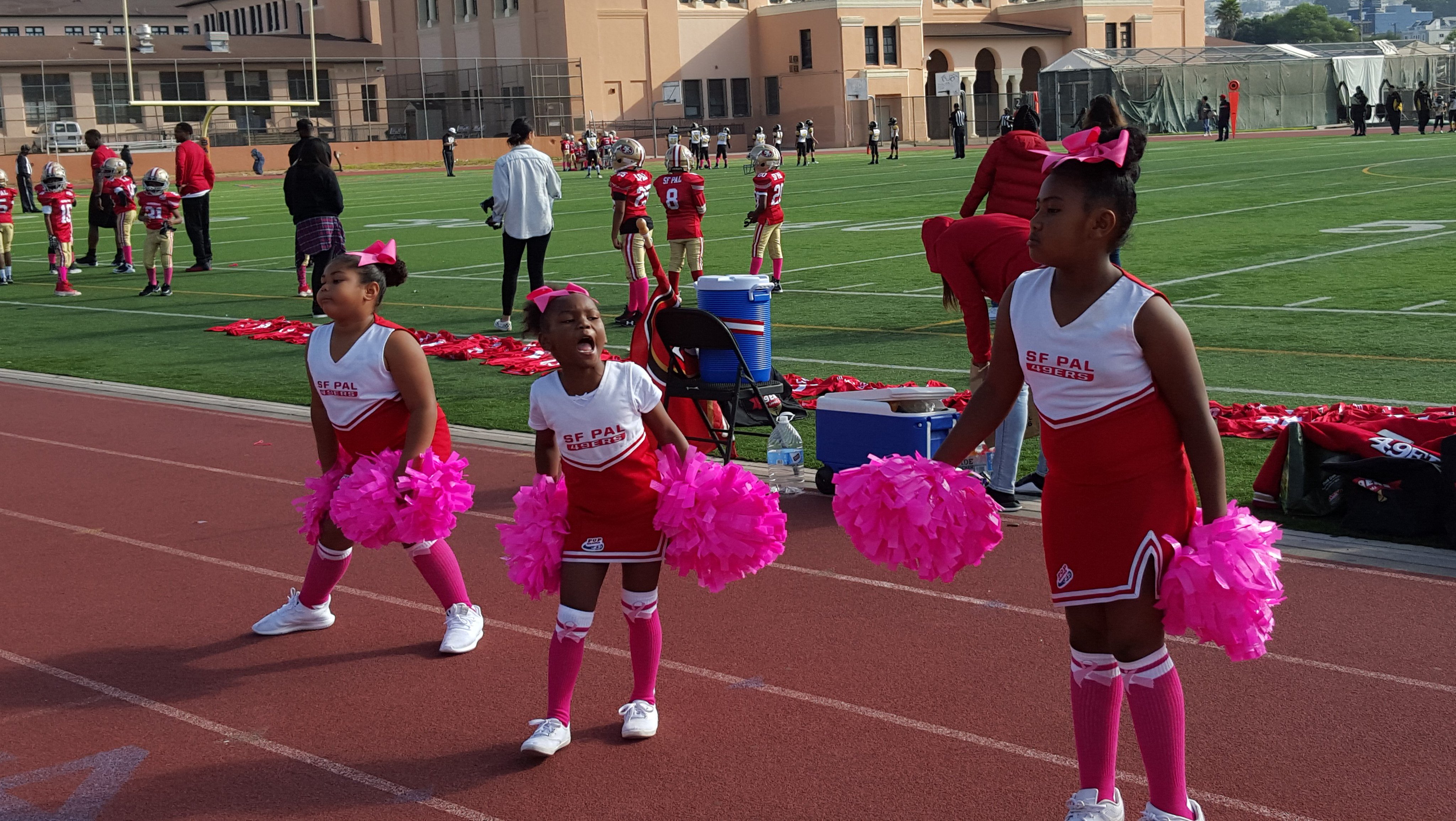 HS football teams showed support during pink October