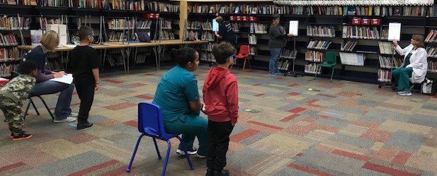 PLVolunteering's tweet photo. Thanks from @PalmerLakeElem to our new friends @AnokaTech, @Rasmussen Brooklyn Park, &amp; @Amplifon for helping out for Vision+Hearing Screening - you made a big difference for our Panthers! #PLtweets #SeeBetterHearBetterDoBetter https://t.co/sFj3LjuEjv
