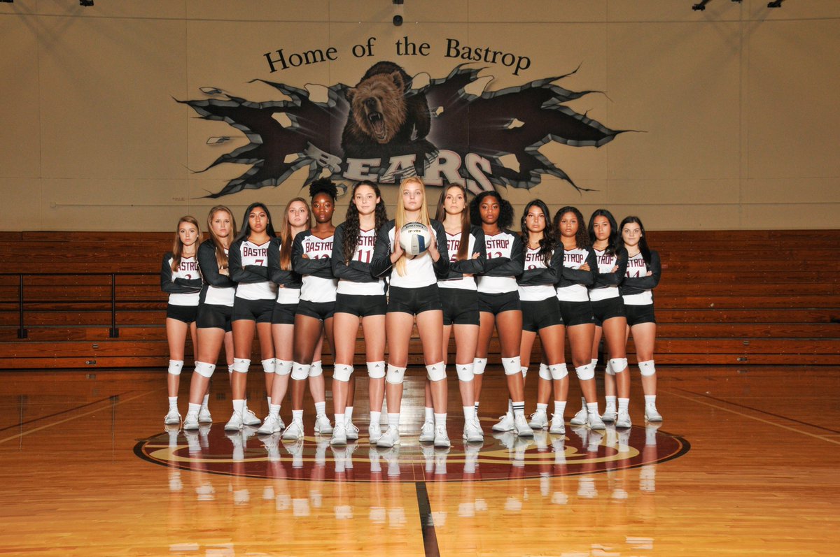 The women's Volleyball team at BHS standing in the gym center court.