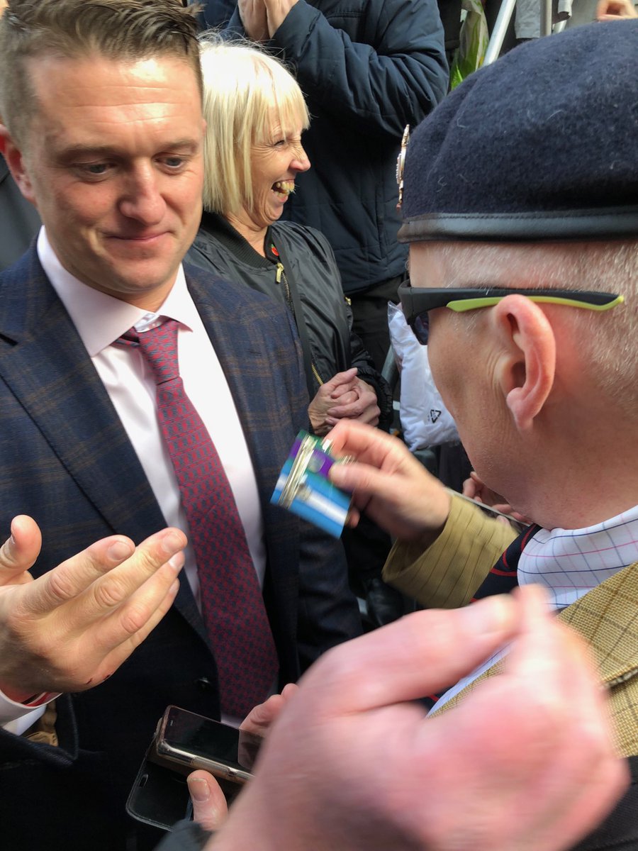 ezralevant's tweet photo. A British military veteran tries to give Tommy Robinson his medals. (Tommy correctly declines, but says thank you.) https://t.co/Sq3xQl1LbK