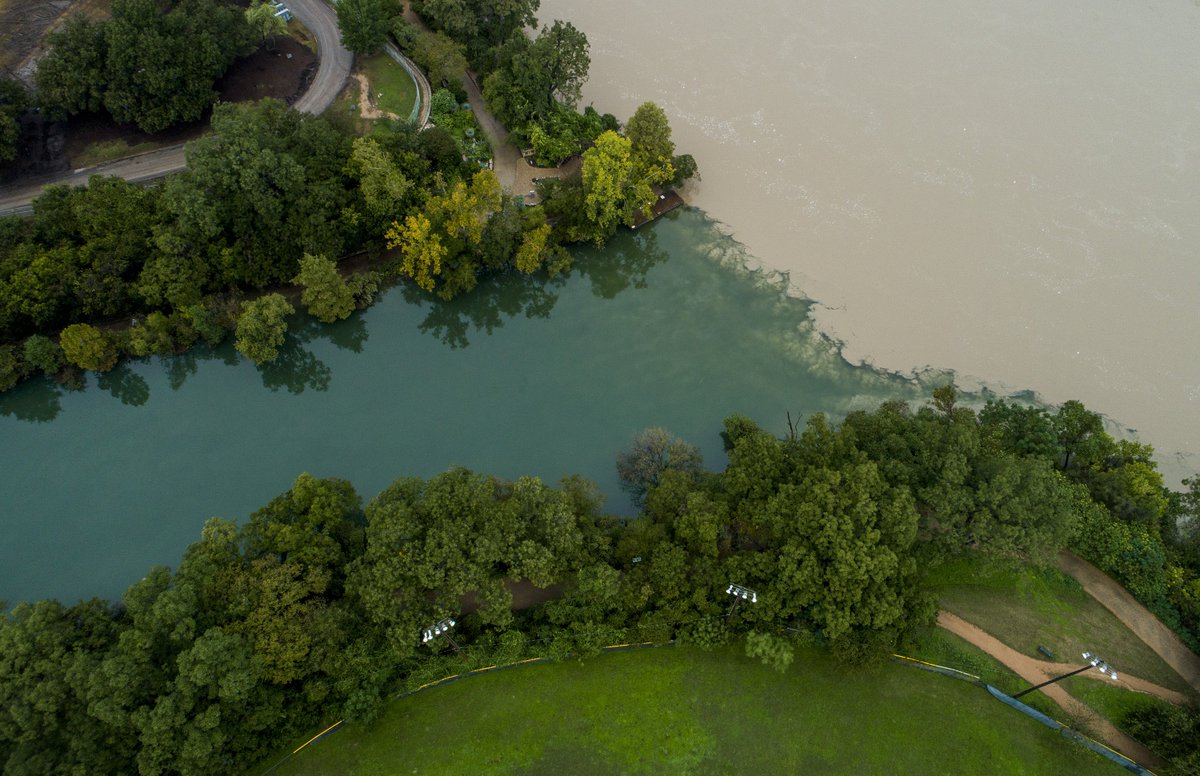 statesman's tweet photo. Aerial images show swollen, silty Lady Bird Lake https://t.co/l5dCmvcHvP https://t.co/OT7WUnMJkk