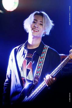 He was the friendliest out of the 5 guys on stage. He smiled the most. Before they start a new set, he reached out to her. She raised her hand but Jaebum quickly pulled it down.The bassist let out a laugh and gave him a salute before backing away."What was that about?"