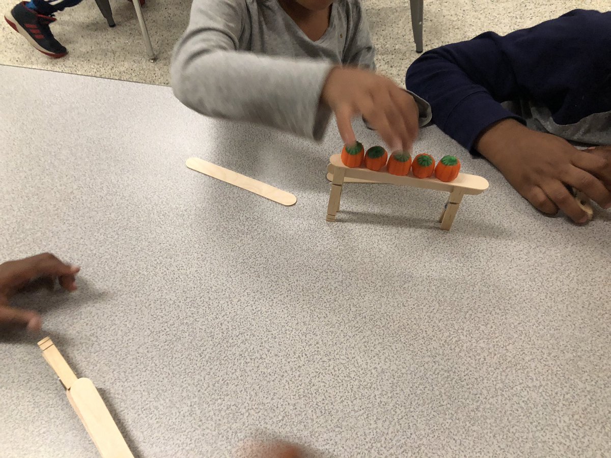 Elem_InnovaSHAN's tweet photo. Today’s IMPROVED 5 Little Pumpkins Lesson with Ms. Carter’s  #firsties! each group got 3 clothespins and 4 craft sticks. With each success I added another challenge!  #STEAM #STEAMteacher #steam_powered_learning #HalloweenSTEM @Henrico_Steam #DumbartonElementary #HLP #LifeREADY https://t.co/3i0qXIVgAp