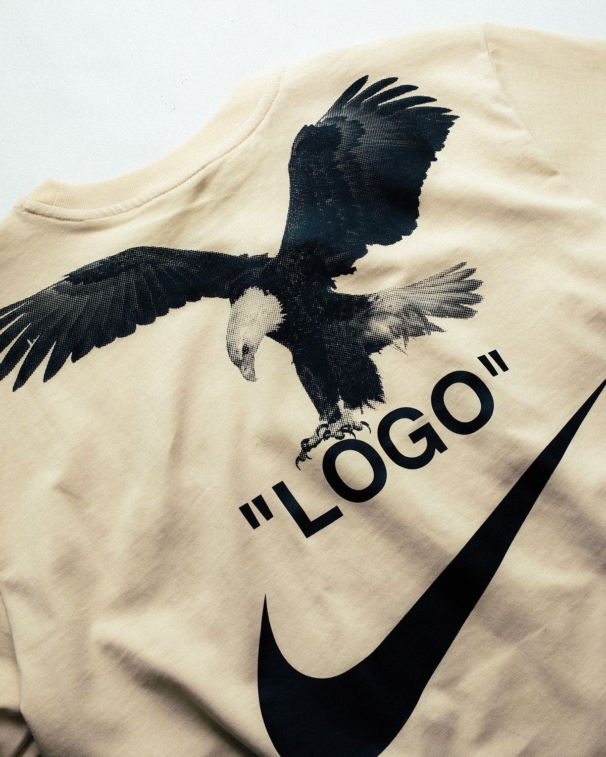 atmos USA X: "Nike x Off-White NRG A6 Tee is now available in-store. The tee featured faux tux screen print with “LOGO” and Swoosh branding on front and eagle with “LOGO”