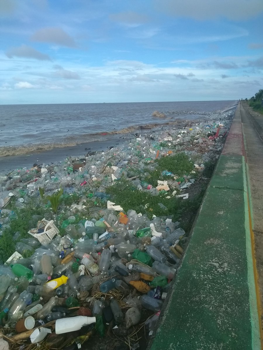 The_CCollective's tweet photo. Not only does this plastic barge pollute the ocean, but it is also one of the stresses on the local infrastructure when it blocks the drains and sluices, causing flooding to the coastal communities #plasticpollution #plasticwaste #disasterriskmanagement #oceancleanup https://t.co/vAS7TjmKq0