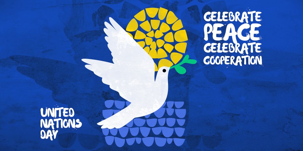 There’s a white dove with a green sprig on the center of this image. It’s in front of two patterns that seem to be forming the illustration of the sun and the sea. On the left side “United Nations Day” can be read and on the right side it is “Celebrate peace, celebrate cooperation”