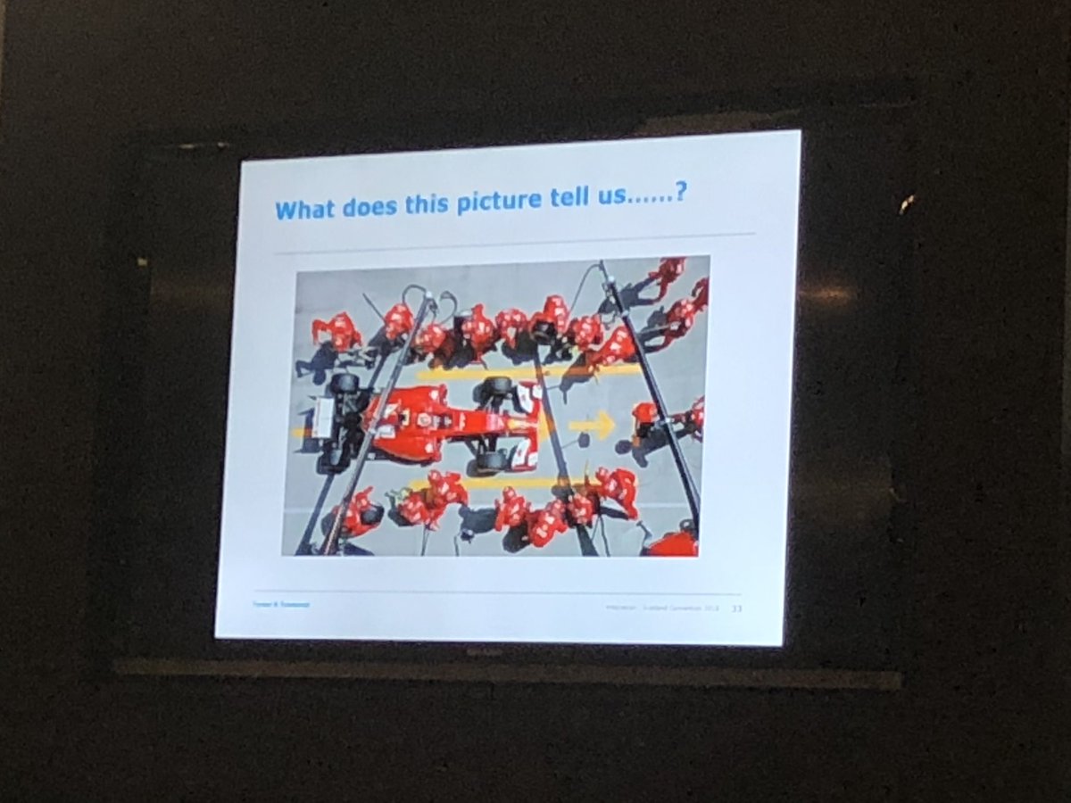 SteveWaltho's tweet photo. Andy Outram of @turnertownsend using formula 1 analogies to convey his message #ttscotcon https://t.co/wvr5LSK6ml