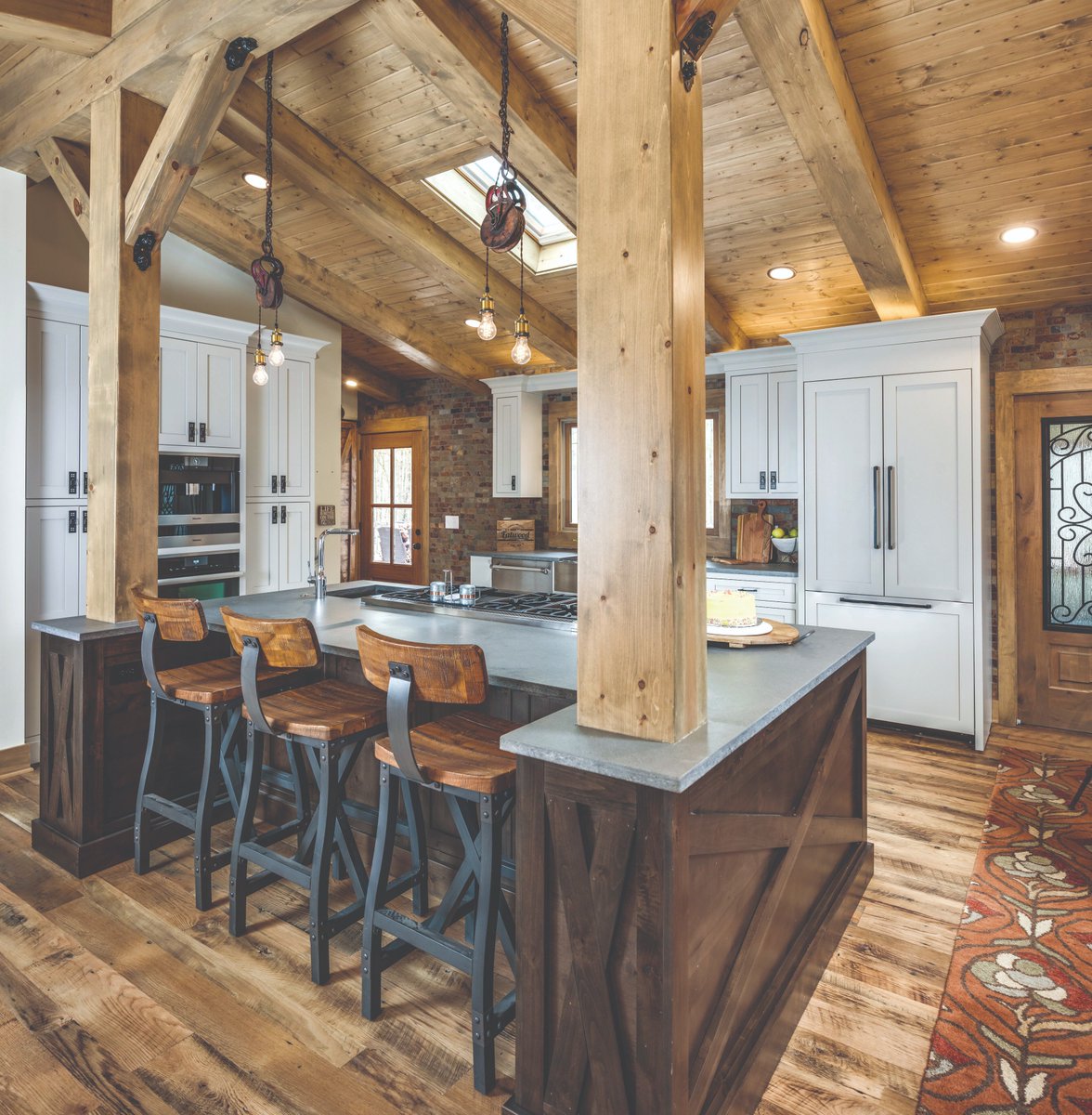 #KBtribechat A5) This rustic kitchen design from EW Kitchens featuring Rugged Concrete is what #lumberjack dreams are made of. We’re seeing a ton of #highceilings and #oversizedkitchenislands 📷 by Stylish Detroit
