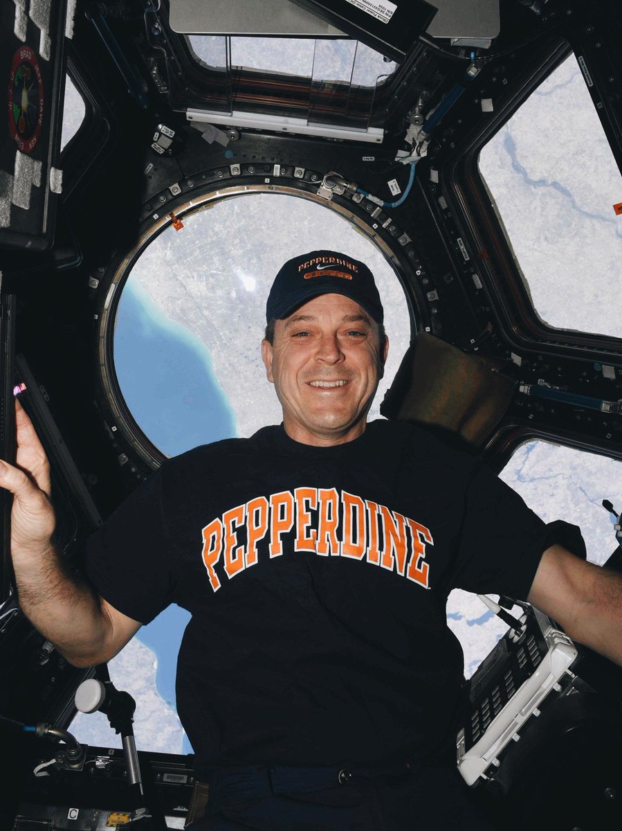 pepperdine's tweet photo. Our Pepperdine family is worldwide, and even out of this world! Ricky Arnold (@astro_ricky), father of both a #SeaverCollege student and a Seaver grad, took this photo while rocking some #Pepperdine gear in outer space! 🌙🛰✨ https://t.co/GqrsG4l7Sg