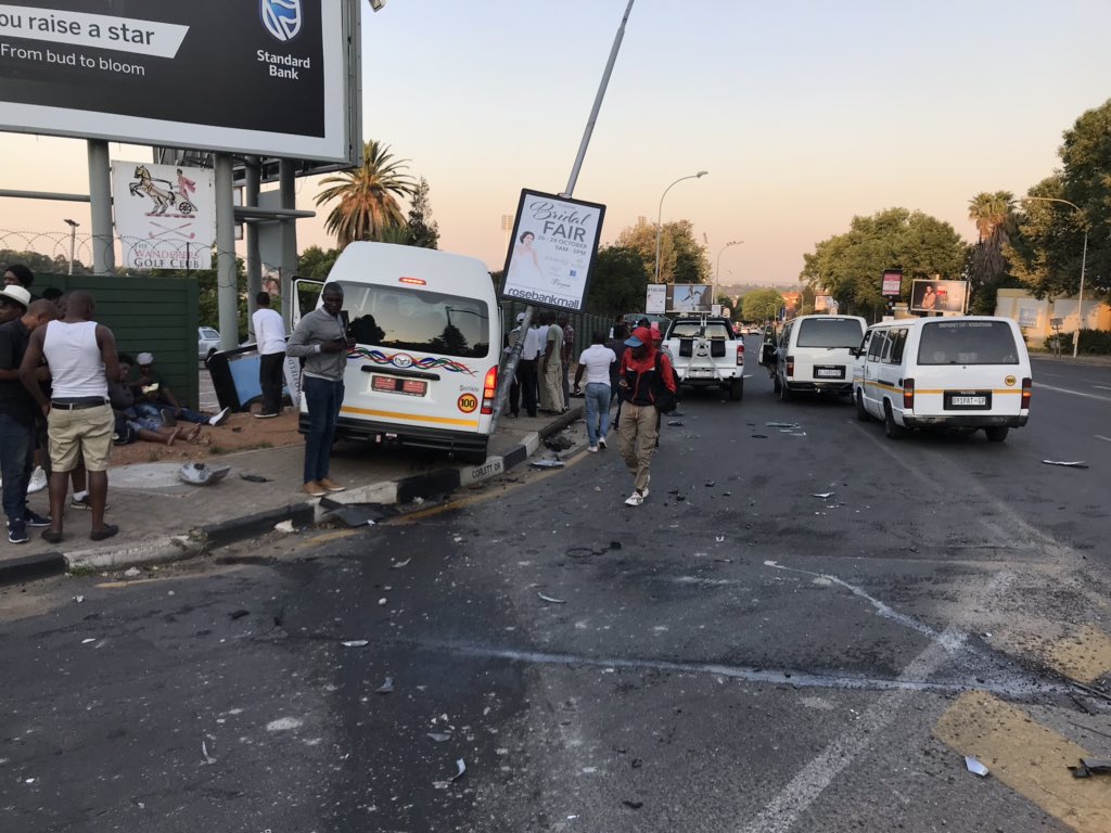 josh_lasker's tweet photo. @MandyWiener @JMPDSafety this taxi just jumped a red robot full of passengers and crashed into the Wanderers Golf Club. The taxi driver fled the scene. https://t.co/GWsQPrT8y3