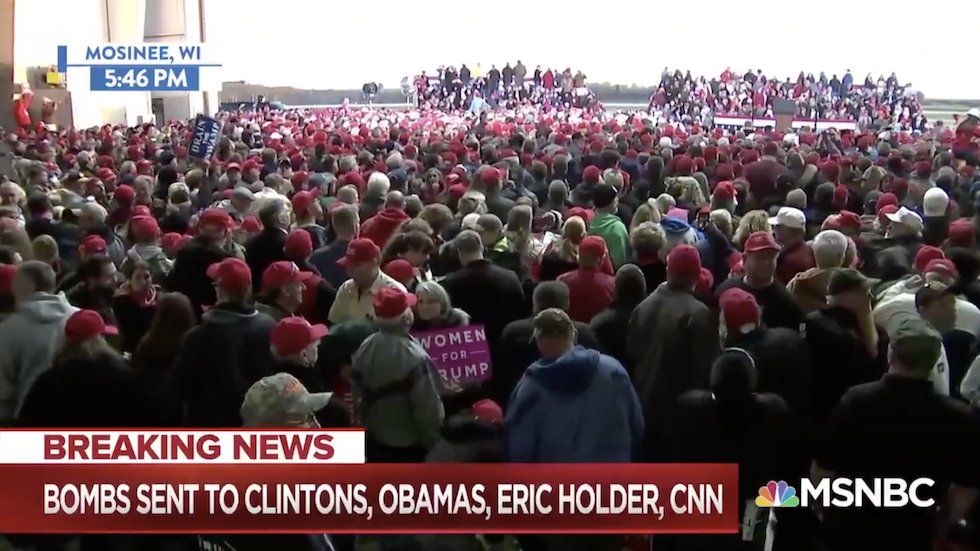 thehill's tweet photo. Trump supporters chants "lock her up" at rally just hours after bomb threats made to Clinton https://t.co/Vw1oyn3iWf https://t.co/fcl2BldsYY
