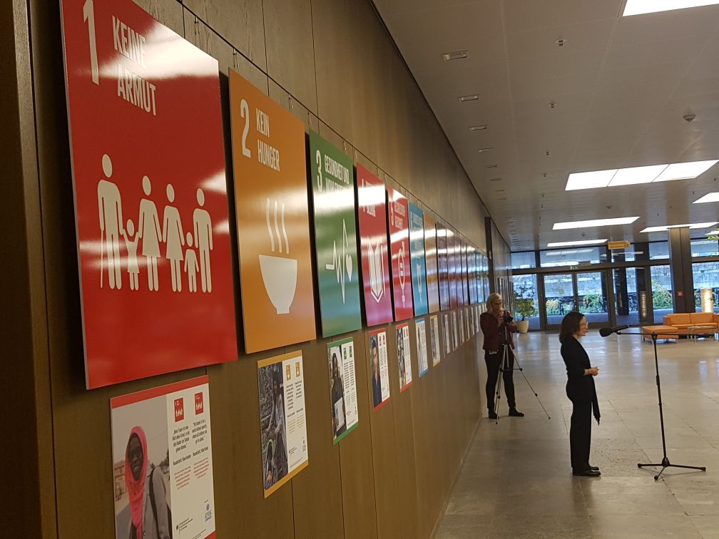 SDGaction's tweet photo. Launch of #act4SDGs exhibit at @BMZ_Bund HQ #Bonn: @SDGAction Global Campaign Center Head @pontimari "#HumansOfMyWorld puts the spotlight on ordinary people &amp; allows them to share what's affecting their lives &amp; what they would like to change in the communities" #SDGs #17ziele https://t.co/kHl93Tm1gs