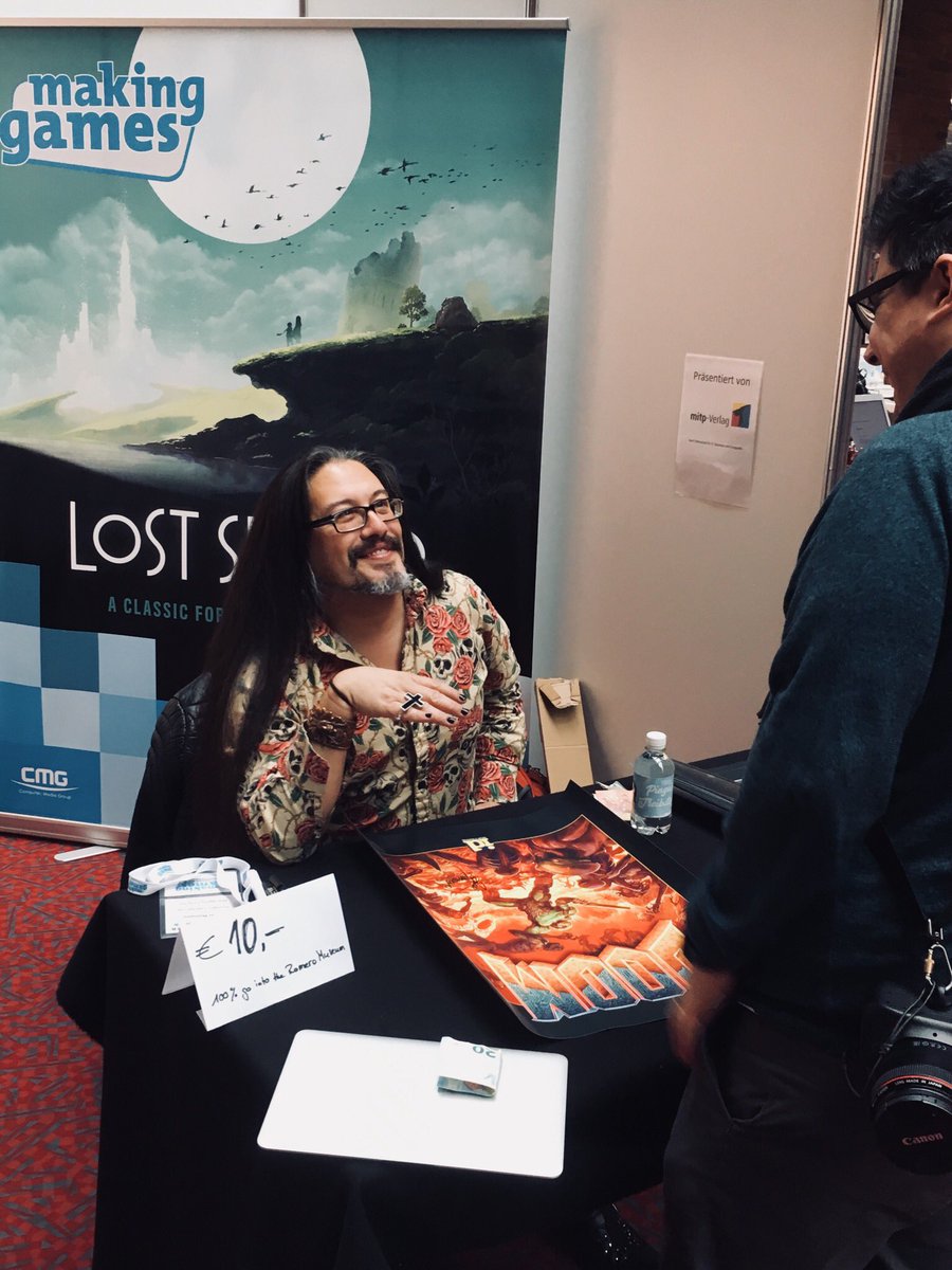 Not only is <a href="/romero/">John Romero 🤘🏽</a> signing <a href="/DOOM/">DOOM</a> posters and taking his time for a chat, he‘s also signing our latest issue! Having a blast at <a href="/MakingGamesConf/">Making Games Conf</a> #25YearsOfRipAndTear