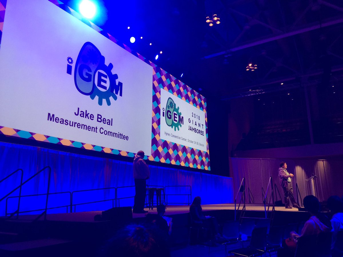 iGEM's tweet image. Talking about Measurement at #iGEM and the results of the #InterLab Jake Beal @Jacob__Beal #GiantJamboree