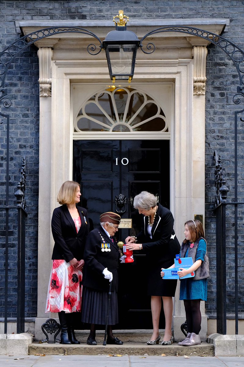 Buying a poppy from Barbara, a war veteran, and Poppy outside Number 10.