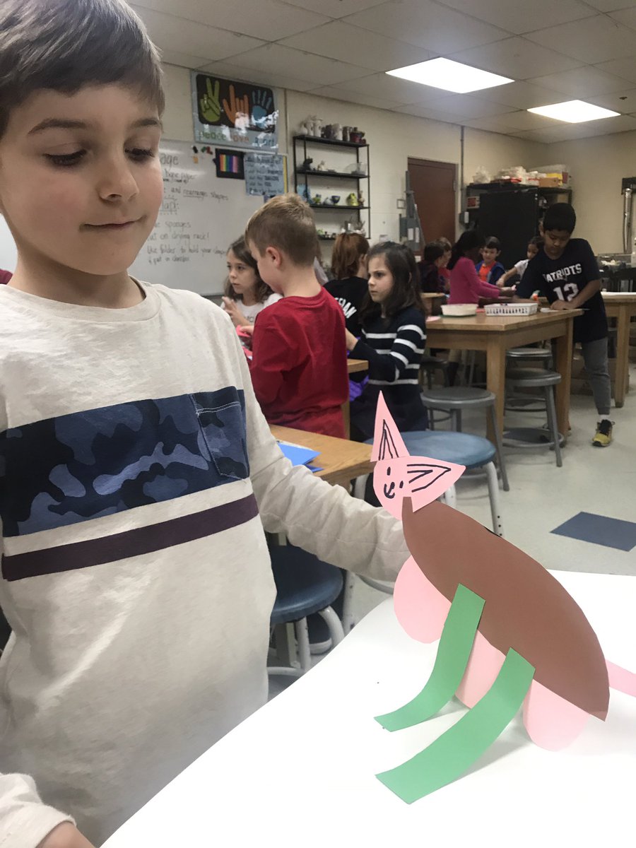This artist decided to use the collage paper to make a paper cat sculpture!