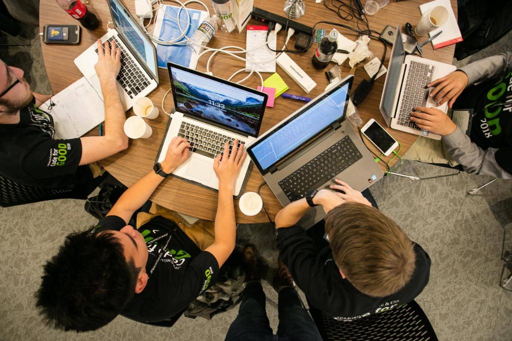 jpmorgan's tweet image. Over 80 student coders worked with $JPM technologists to help nonprofits @OhioGuidestone and Refuge Hub. Here's a peak at them developing their ideas at our #CodeForGood challenge in #Ohio.