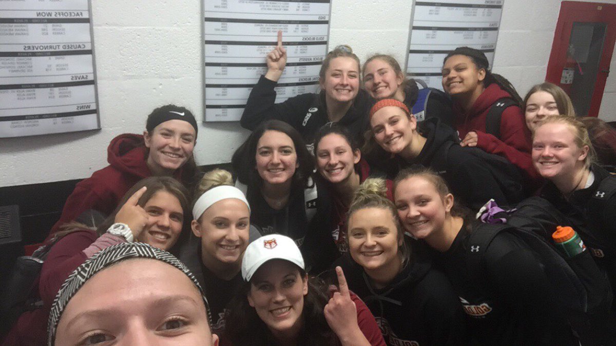 AlverniaWVb's tweet photo. Great win tonight vs Albright! Way to finish up conference play! One more match at Ramapo on Saturday!  Let’s Go Wolves! 💛🐺🏐🔥 (shoutout to the team for taking a selfie next to coach’s record on the wall) https://t.co/kS6JChKTx6