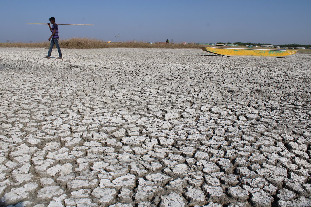 .Boat laying idle in dry Nal Sarovar Bird Sanctuary in gujarat, Nalsarovar Lake which is generally a popular tourist destination around Sanand-Viramgam region during this part of the year has dried down owing to water scarcity and cut in Narmada water for it....