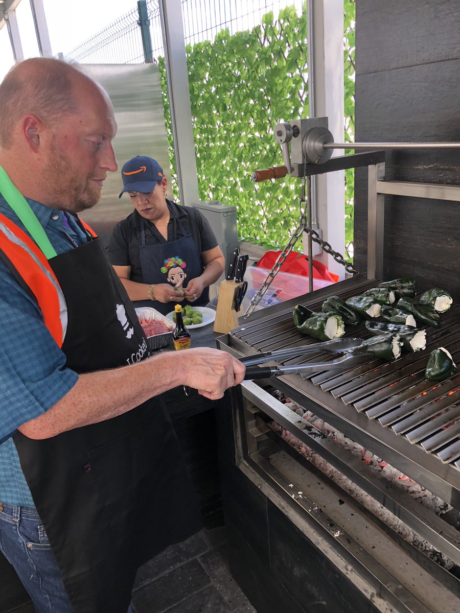 dalperdah's tweet photo. Being schooled in the proper grilling of carne asada and stuffed peppers by the MX Ops Team. #behindthesmiles #mex3 #amazonmexico https://t.co/VZdg394VVn