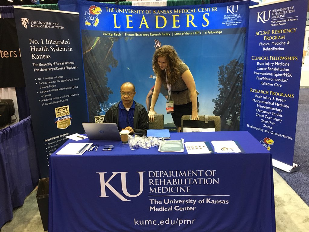 Drs. Alm, Clark, and Mr. Franklin having fun working at our booth at the AAPM&amp;R Annual Assembly.