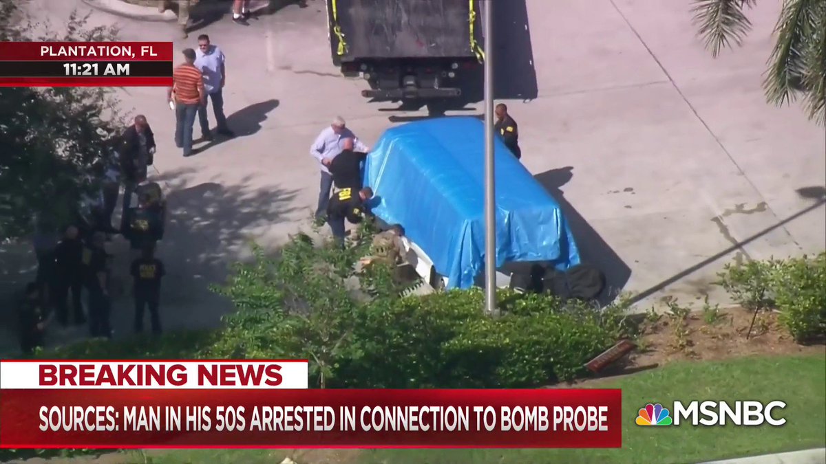 MSNOWNews's tweet image. A tarp has been placed over the van, and a tow truck has been brought in and set to take it from the scene in Plantation, Florida.