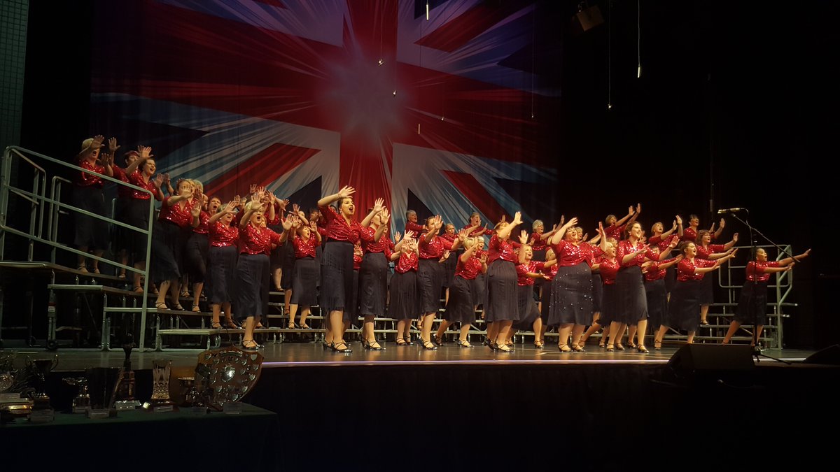 #LABBS18 Contestant No 25, from Preston, under the direction of Emma McManus, it's The Red Rosettes. They're singing If Ever I Would Leave You and Let's Burn Up the Town.