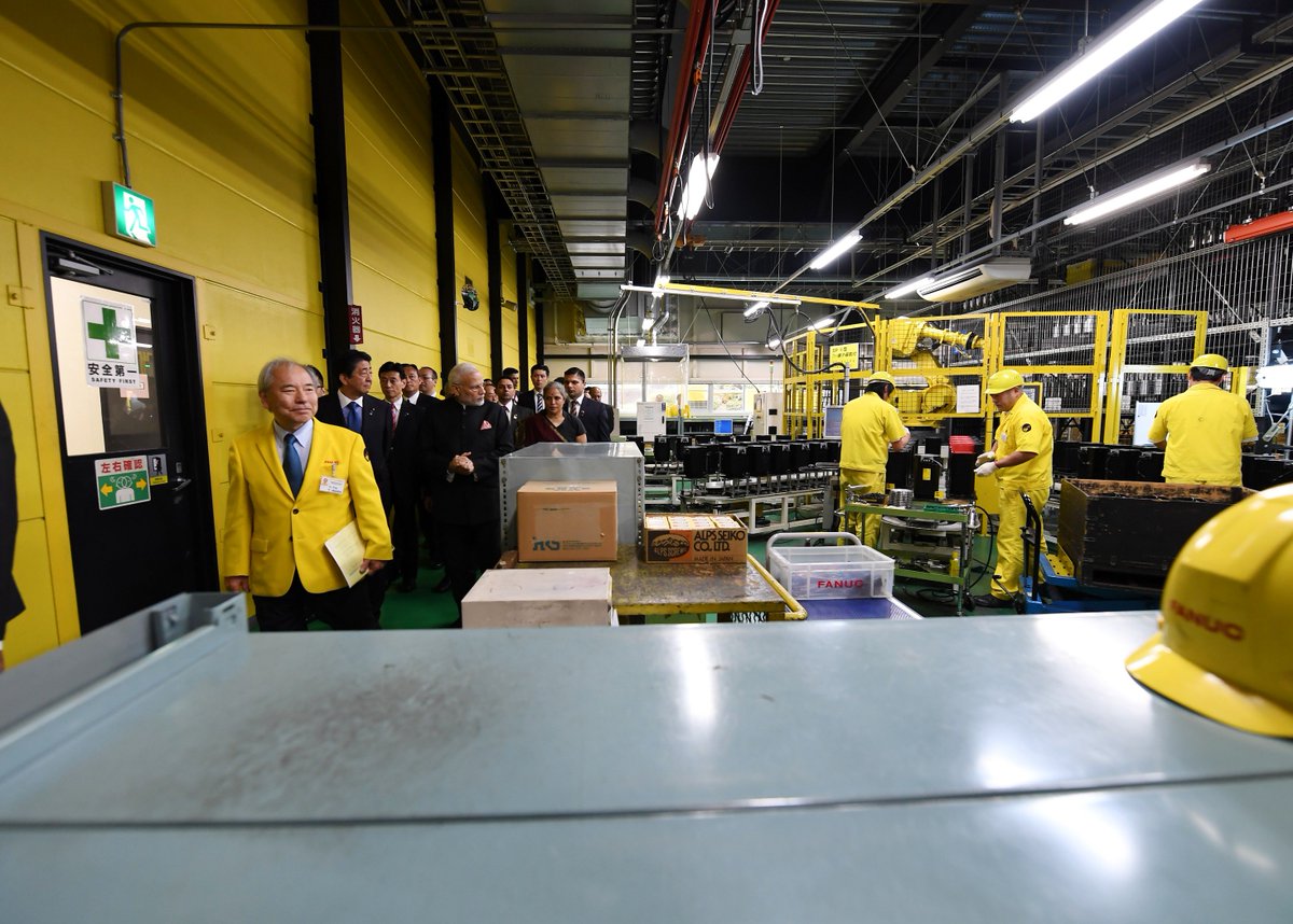 narendramodi's tweet photo. PM @AbeShinzo and I visited the FANUC Corporation, which has pioneered the usage and application of technology, particularly in robotics. https://t.co/azKBfzwEla