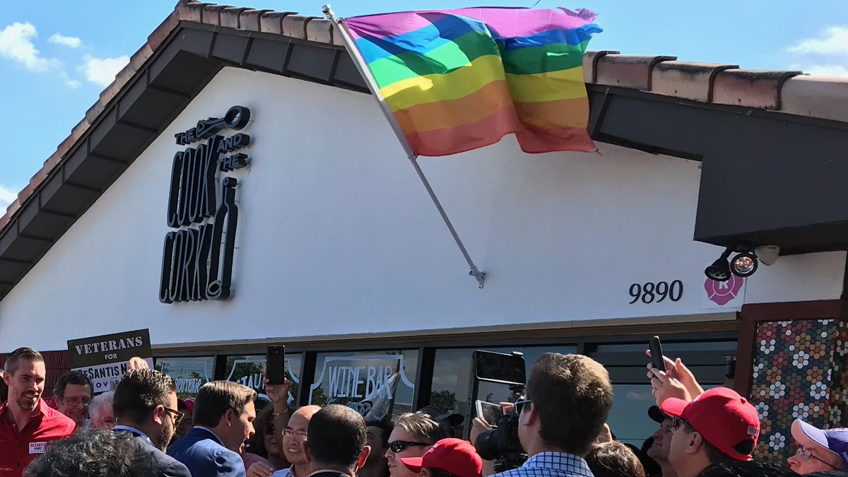 browardpolitics's tweet image. After his Coral Springs rally, ⁦⁦@RonDeSantisFL⁩ shakes hands with supporters in front of The Cook and The Cork restaurant flying #LGBT pride flag. DeSantis isn’t supporter of LGBT community. Rally attendees were told they couldn’t park in restaurant’s lot.