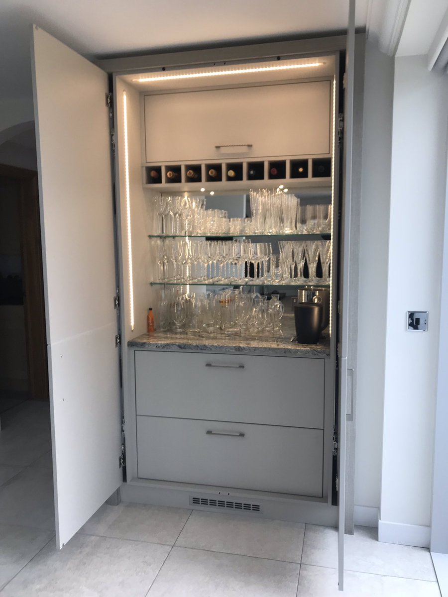 We spent a few days turning these panels from @Masterclasskitc into something a bit special 🥂#drinkscabinet #pocketdoors #fridgedrawers