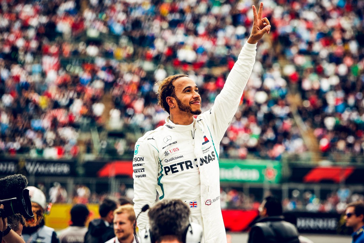 Lewis Hamilton raises a hand in appreciation to the incredible Mexico crowd after taking his fifth title!