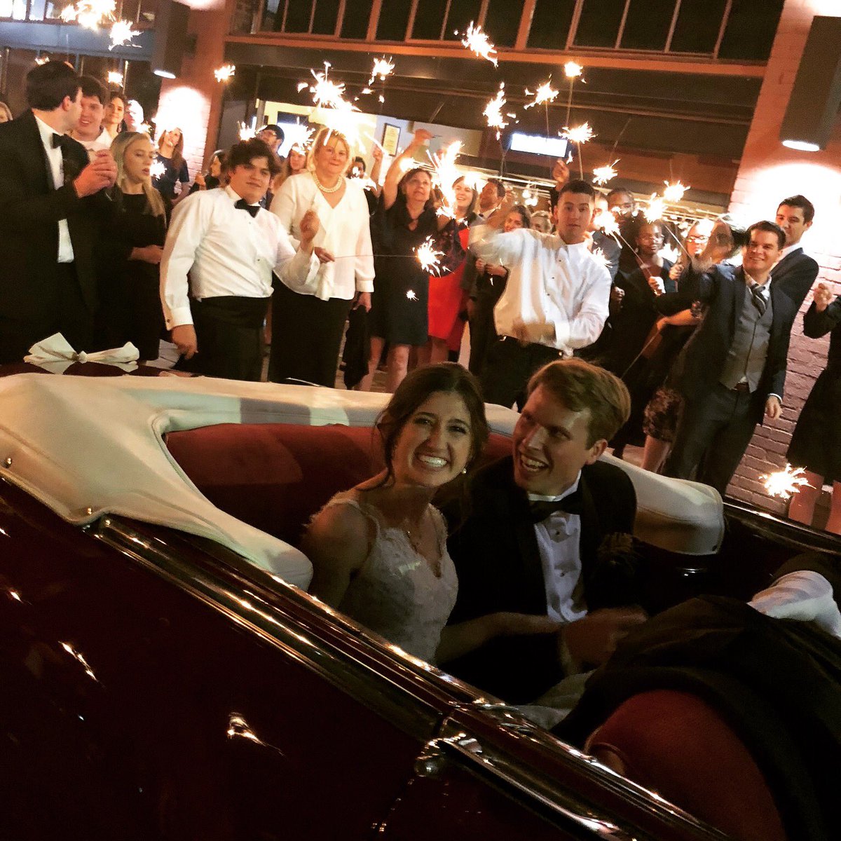 Sarah and Wilson great couple given their first ride together after their wedding reception in “Ruby “
robconradsclasscars.com