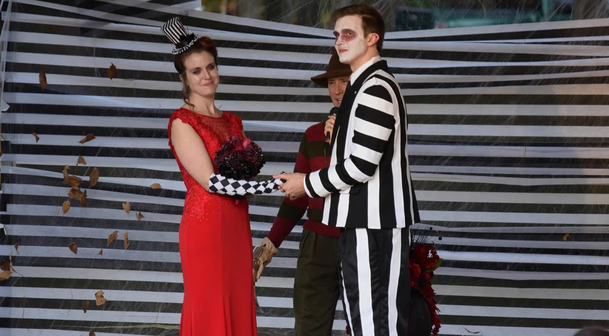 Alex and Kait's Beetlejuice wedding, with Freddy Krueger on stage.