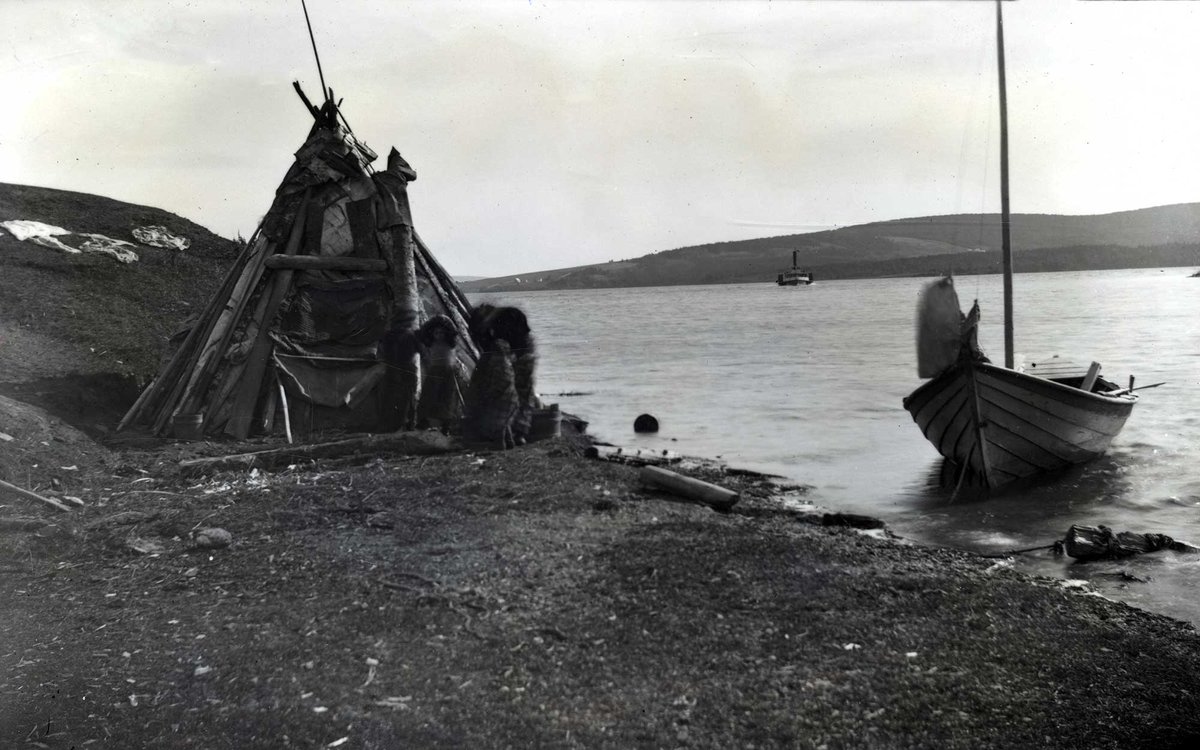 beatoninstitute's tweet photo. A Mi'kmaw #wikuom along the shores of #Pitupok, Bras d'Or Lake, ca. 1895. A steamer ship, quite likely the #SSMarion, can be seen on the water. Reference number: 81-1239-6319. https://t.co/7Nt3OmJ4JS