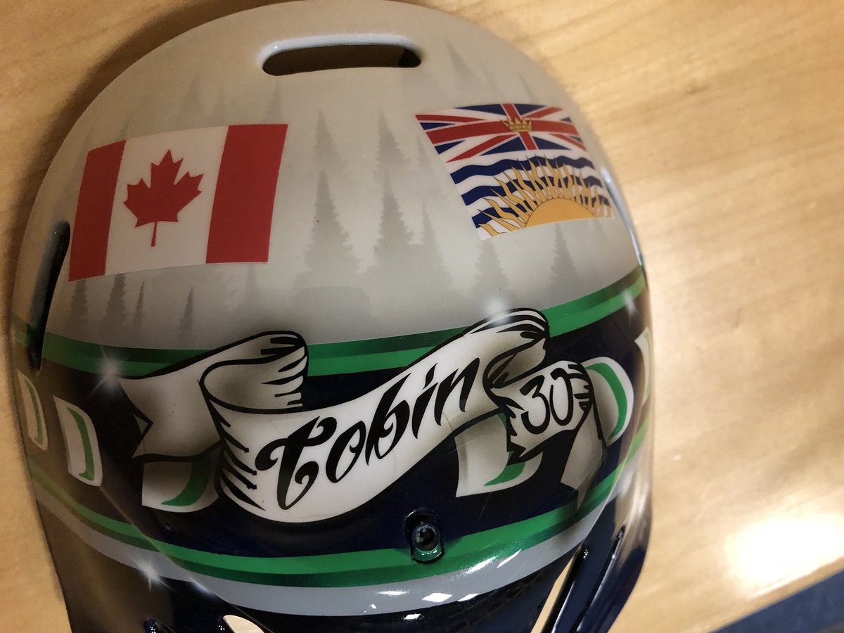SeattleTbirds's tweet photo. The backplate of Hughes’ new mask has a tribute to former T-Birds goalie prospect and former @HumboldtBroncos goalie Parker Tobin who wore Number 30, the number Hughes now wears, at two T-Birds Training Camps. #HumboldtStrong 💚💛 https://t.co/Pq22HjXHyh