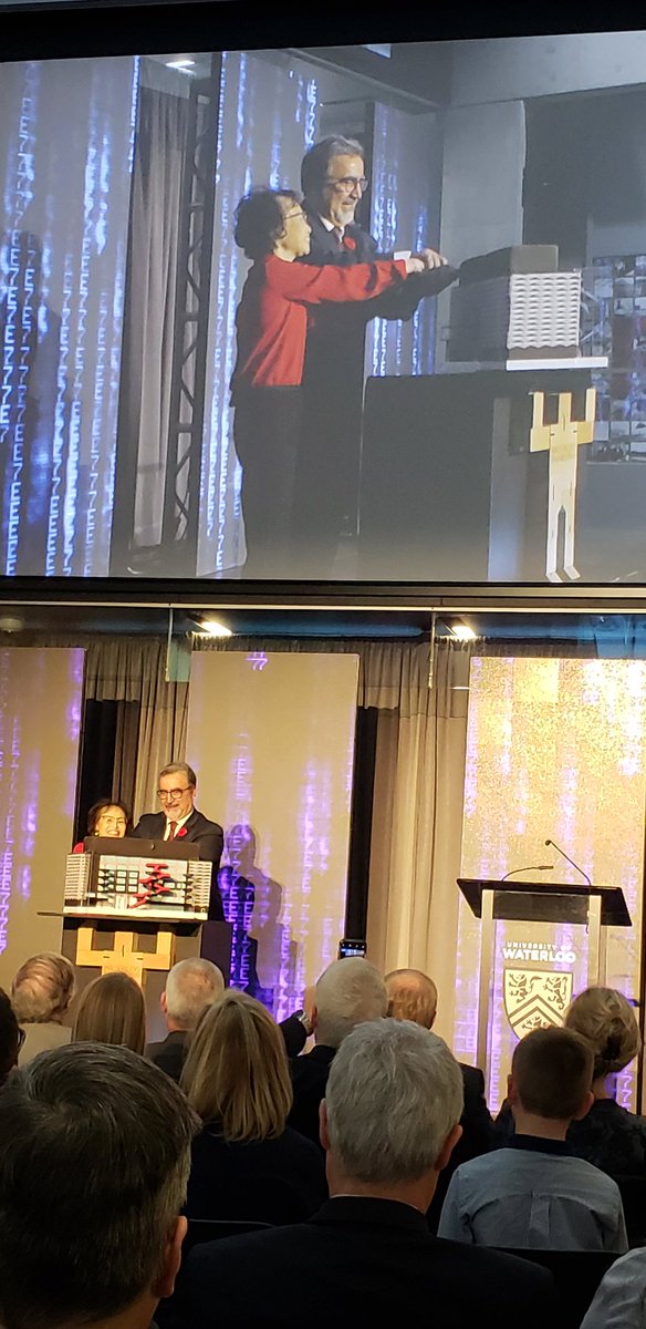 Cutting the cake delivered by robot to open Eng 7 <a href="/UWaterloo/">University of Waterloo</a>