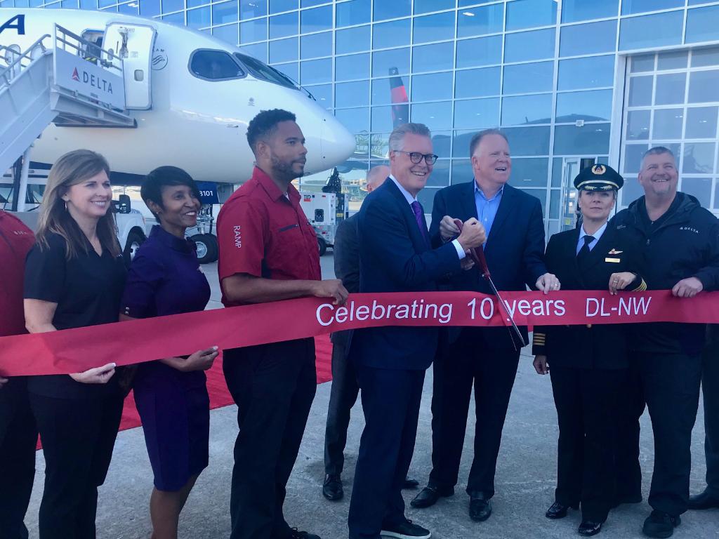 Delta's tweet photo. Ten years ago today, the Delta-Northwest merger was approved. To celebrate this milestone, we’re taking a look into the future as our brand new A220 arrives in ATL. https://t.co/OCeLfQdBXn