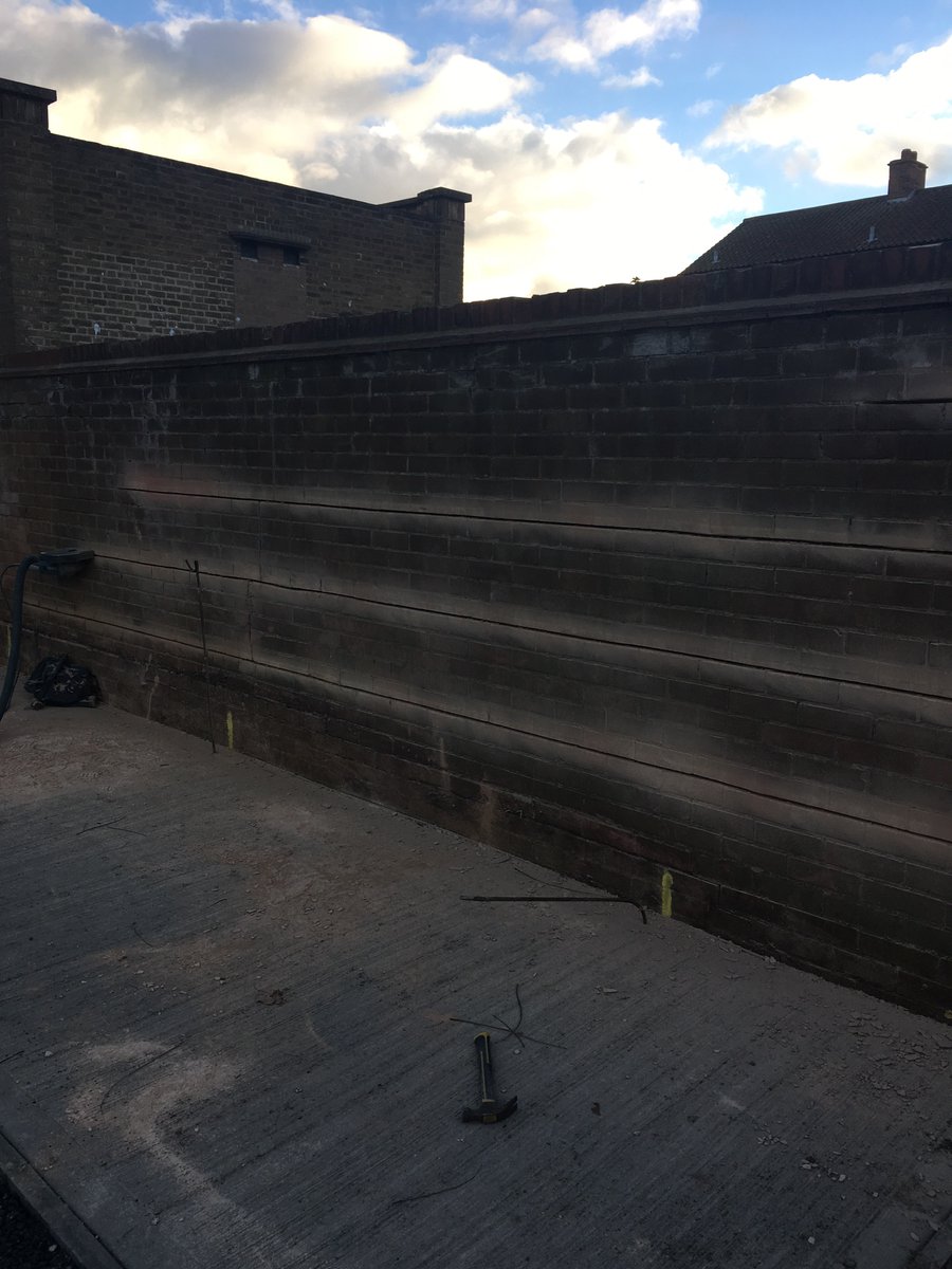 Structural repairs on going to a boundary wall suffering from thermal movement #NBS Insallation of masonry beams #twistfix and crack injection #steadfastspl