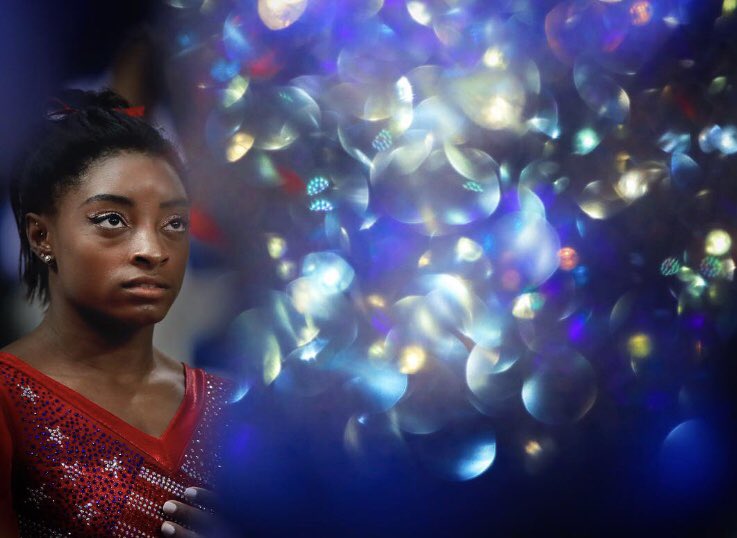 Gymnastics World Champion Simone Biles waits for the medal ceremony after winning gold with the U.S. team in Doha, Qatar, Oct. 30, 2018.