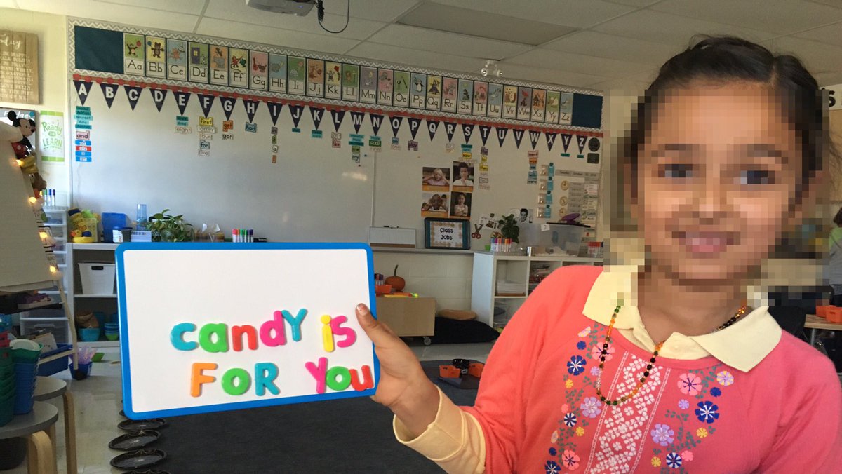 Another kiddo in the Halloween mood... A. wrote "Candy is for you." using magnetic letters.