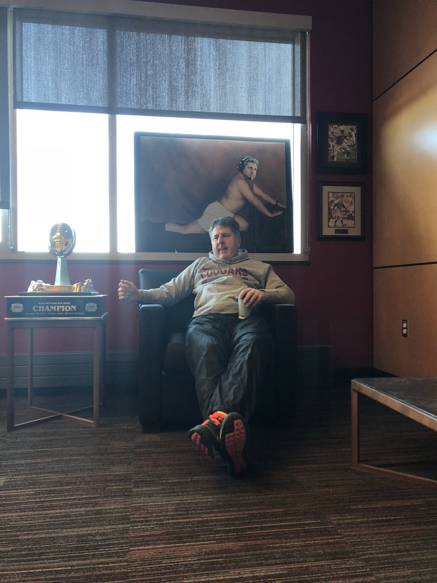 The new piece of art work in @Coach_Leach office has made it nearly impossible to have a serious meeting 👀😂. #GoCougs #JoinTheHunt