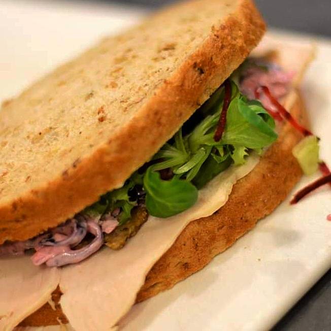 surface_cafe's tweet image. It's nearly 'Festive Sandwich' time @ our cafe. Here goes....Turkey, horseradish mayo, cranberry sauce, homemade coleslaw, salad and topped with mixed root vegetables crisps for that special crunch! **Replace turkey with Falafel for our veggie option :) #xmassandwich #sandwich