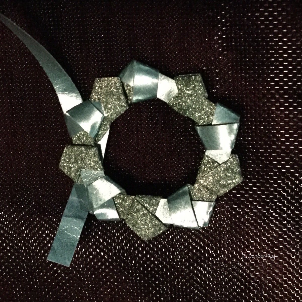 HypercubicPeg's tweet photo. It's not as accurate as I would like it, but I have figured out how to knot/fold a #pentagon ring from a ribbon.

I think that  means that I should be able to knot a pentagon squiggle if I can keep track if the direction switching.

#polygonsquiggles #paperstrips https://t.co/S7OSPtu6eW