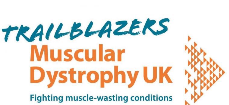 The Trailblazers Muscular Dystrophy UK logo.  “Fighting muscle-waiting conditions.