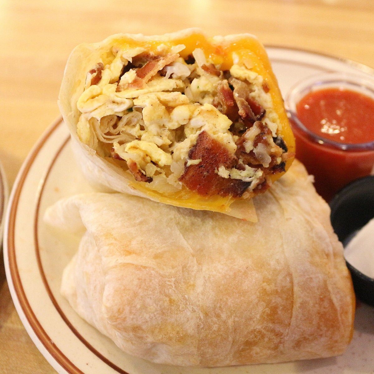 Everything you love all wrapped up. 🥓🧀🍳🥔 🌯 #BreakfastBurrito #LaJolla #Harrys #EatAtHarrys #LaJollaCalifornia #SanDiegoBrunch #SanDiegoFood #SDBrunch #SanDiegoLove #SunnySanDiego #lajollabeach #Brunch #EdibleSD